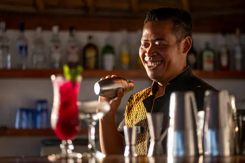 Bartender mixing cocktails at the Beach Bar