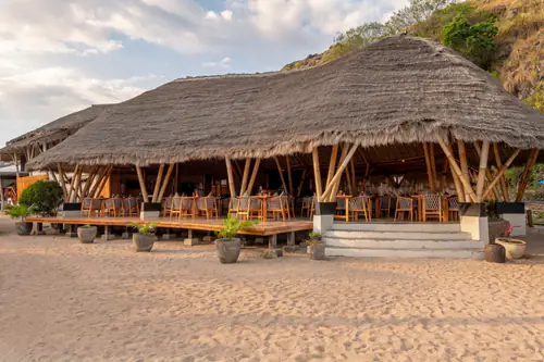 The Sunset Restaurant from the beach at golden hour