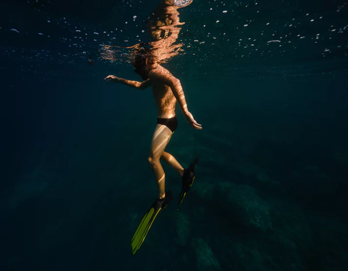 Sunlit underwater scene at Crystal Rock dive site, Komodo National Park