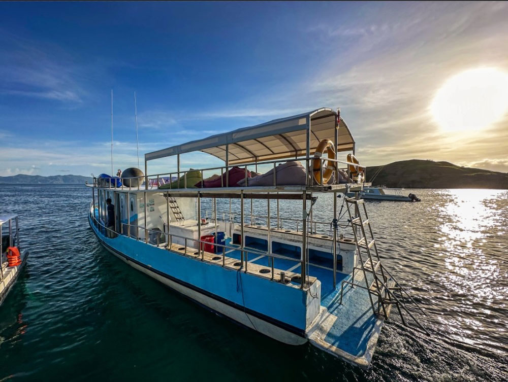 Divers on a tender boat heading to a dive site in Komodo National Park